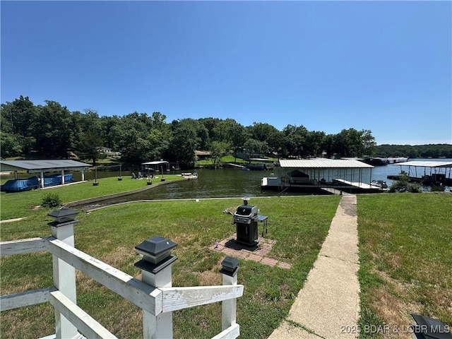 30024 Hawaii Rd, Gravois Mills, MO 65037 - view of green lawn featuring a water view, a boat dock, and boat lift