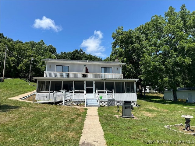 30024 Hawaii Rd, Gravois Mills, MO 65037 - rear view of house featuring a sunroom and a yard