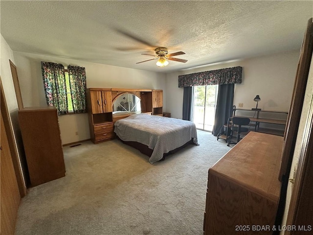 30024 Hawaii Rd, Gravois Mills, MO 65037 - bedroom featuring access to exterior, a textured ceiling, light carpet, and a ceiling fan