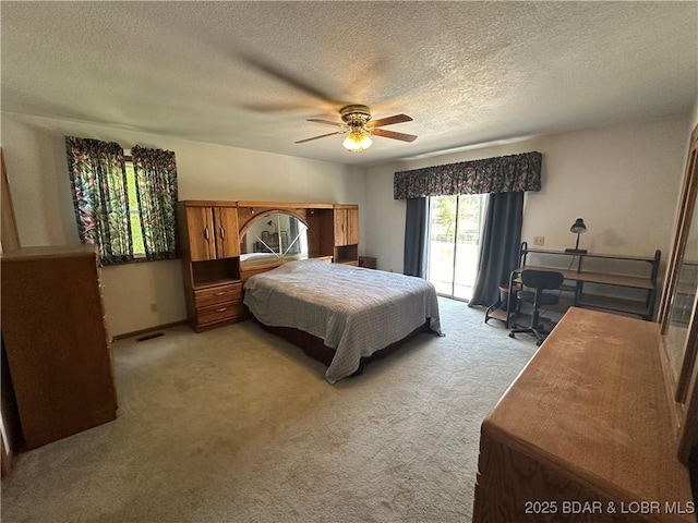 30024 Hawaii Rd, Gravois Mills, MO 65037 - bedroom featuring access to exterior, carpet floors, a textured ceiling, and ceiling fan
