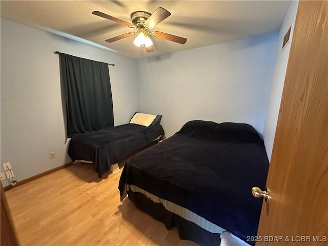 30024 Hawaii Rd, Gravois Mills, MO 65037 - bedroom with light wood-style flooring and ceiling fan