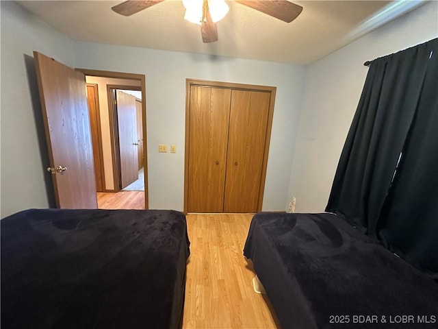 30024 Hawaii Rd, Gravois Mills, MO 65037 - bedroom featuring light wood-style flooring, a ceiling fan, and a closet