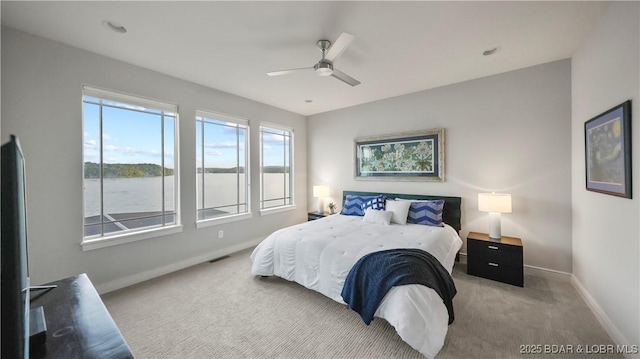 777 Malibu Rd, Osage Beach, MO 65065 - bedroom featuring light carpet and a ceiling fan