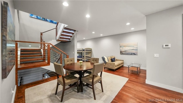 777 Malibu Rd, Osage Beach, MO 65065 - dining space featuring stairway, wood finished floors, and recessed lighting