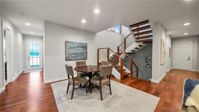 777 Malibu Rd, Osage Beach, MO 65065 - dining area featuring stairs, wood finished floors, and recessed lighting
