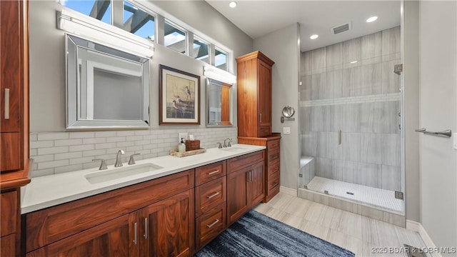 777 Malibu Rd, Osage Beach, MO 65065 - bathroom featuring double vanity, a shower stall, decorative backsplash, recessed lighting, and tile patterned flooring