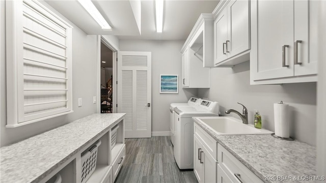 777 Malibu Rd, Osage Beach, MO 65065 - laundry area featuring cabinet space, separate washer and dryer, and dark wood-style flooring