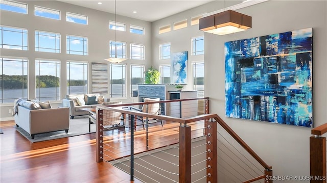 777 Malibu Rd, Osage Beach, MO 65065 - hall featuring recessed lighting, wood finished floors, and a towering ceiling