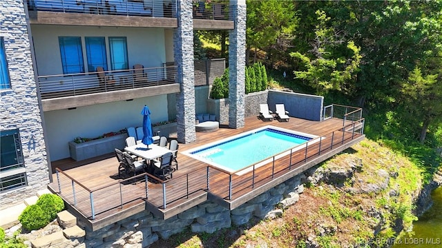 777 Malibu Rd, Osage Beach, MO 65065 - swimming pool featuring a wooden deck and outdoor dining area