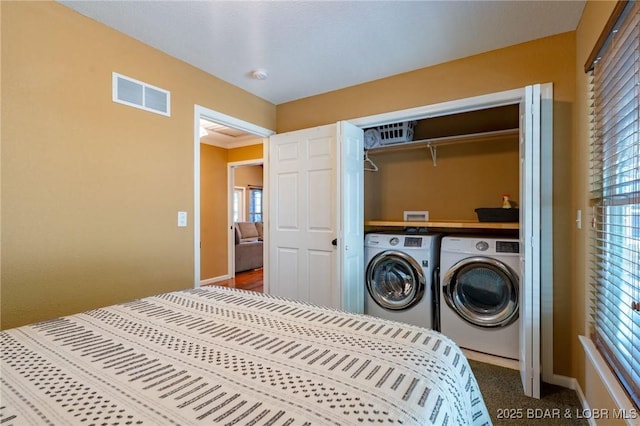 30310 Old Peony Rd, Gravois Mills, MO 65037 - bedroom featuring washing machine and dryer, multiple windows, and a closet
