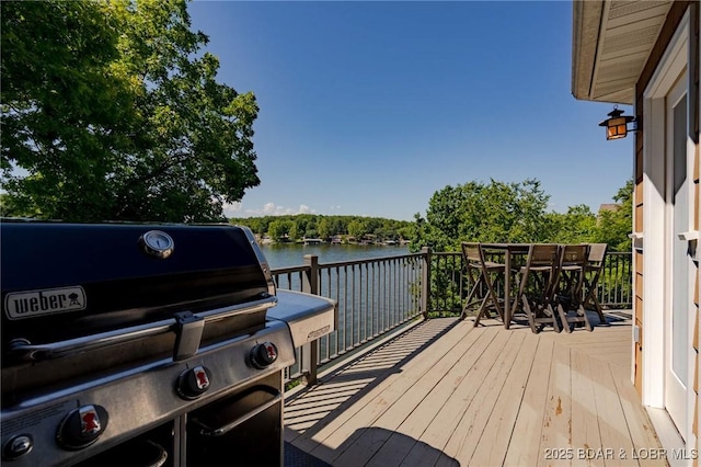 30310 Old Peony Rd, Gravois Mills, MO 65037 - deck featuring area for grilling, a water view, and outdoor dining area