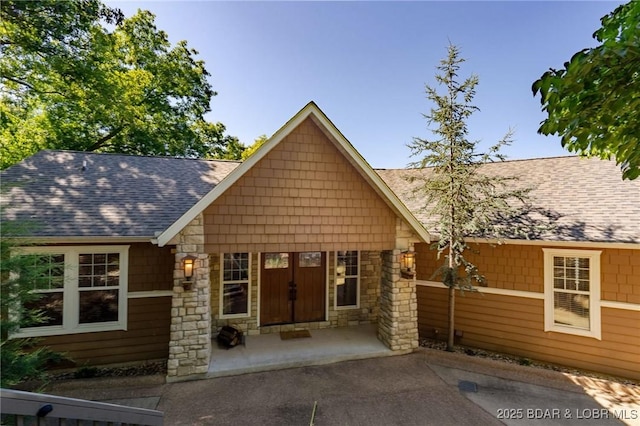 30310 Old Peony Rd, Gravois Mills, MO 65037 - view of front facade featuring stone siding and roof with shingles