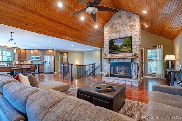 30310 Old Peony Rd, Gravois Mills, MO 65037 - living area with wooden ceiling, ceiling fan, high vaulted ceiling, wood finished floors, and a fireplace