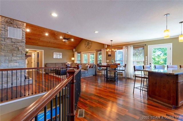 30310 Old Peony Rd, Gravois Mills, MO 65037 - living room with lofted ceiling, dark wood finished floors, recessed lighting, a chandelier, and ceiling fan