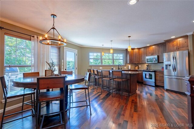 30310 Old Peony Rd, Gravois Mills, MO 65037 - dining room with dark wood finished floors, a chandelier, crown molding, and recessed lighting