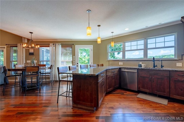 30310 Old Peony Rd, Gravois Mills, MO 65037 - kitchen featuring dishwasher, dark wood-style flooring, crown molding, a breakfast bar, and stone countertops