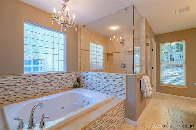 30310 Old Peony Rd, Gravois Mills, MO 65037 - bathroom featuring a chandelier, walk in shower, a whirlpool tub, and tile patterned flooring