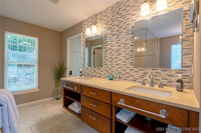 30310 Old Peony Rd, Gravois Mills, MO 65037 - bathroom with double vanity, tile patterned floors, and decorative backsplash