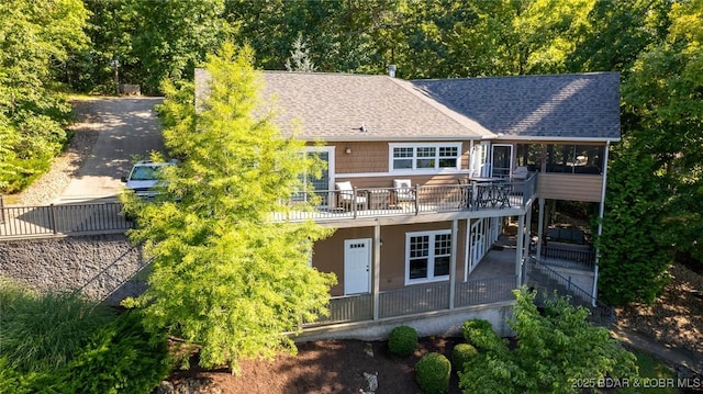 30310 Old Peony Rd, Gravois Mills, MO 65037 - rear view of house featuring a shingled roof, a deck, and a patio area