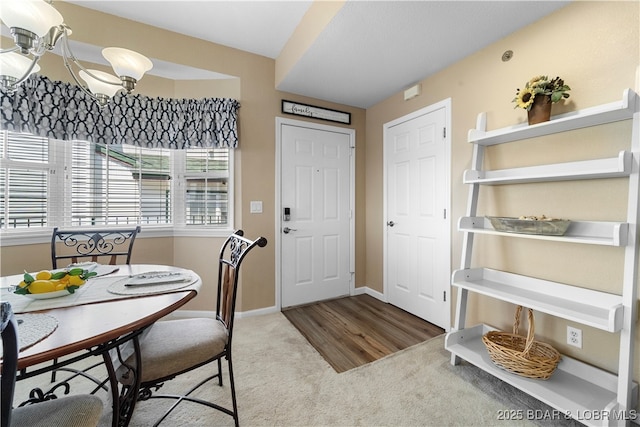 708 Harbour Towne Dr Unit E-708, Lake Ozark, MO 65049 - dining room with carpet and a chandelier