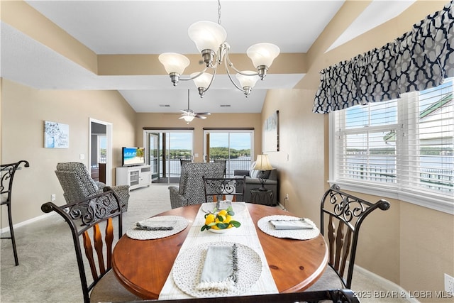 708 Harbour Towne Dr Unit E-708, Lake Ozark, MO 65049 - carpeted dining area featuring lofted ceiling and a chandelier