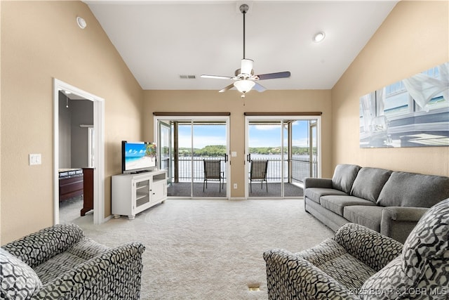708 Harbour Towne Dr Unit E-708, Lake Ozark, MO 65049 - living room with carpet, a ceiling fan, and high vaulted ceiling