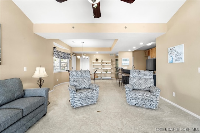 708 Harbour Towne Dr Unit E-708, Lake Ozark, MO 65049 - living room with light carpet, a ceiling fan, a tray ceiling, and recessed lighting