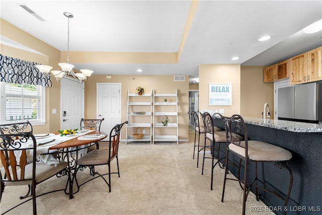 708 Harbour Towne Dr Unit E-708, Lake Ozark, MO 65049 - dining room featuring light colored carpet, recessed lighting, and a chandelier