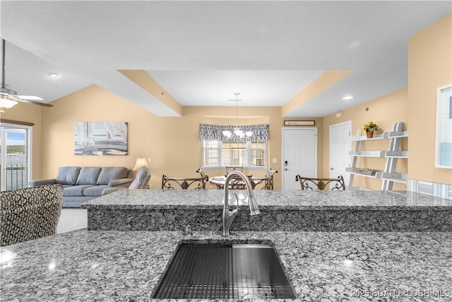 708 Harbour Towne Dr Unit E-708, Lake Ozark, MO 65049 - kitchen with a chandelier, stone countertops, and plenty of natural light