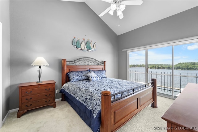 708 Harbour Towne Dr Unit E-708, Lake Ozark, MO 65049 - bedroom with light colored carpet, access to exterior, high vaulted ceiling, a water view, and a ceiling fan
