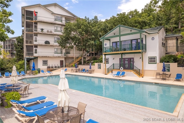 708 Harbour Towne Dr Unit E-708, Lake Ozark, MO 65049 - community pool with a patio area and stairs