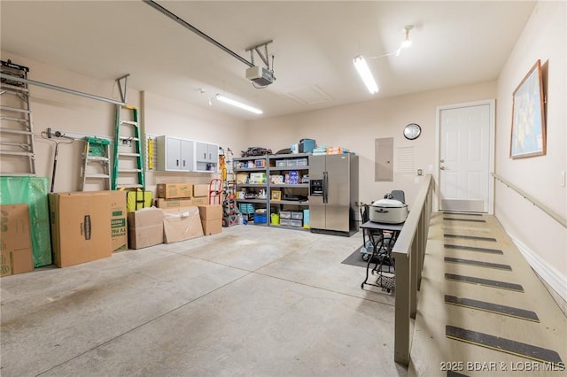 4331 Sunset Dr Unit B, Osage Beach, MO 65065 - garage with stainless steel fridge with ice dispenser, a garage door opener, and electric panel