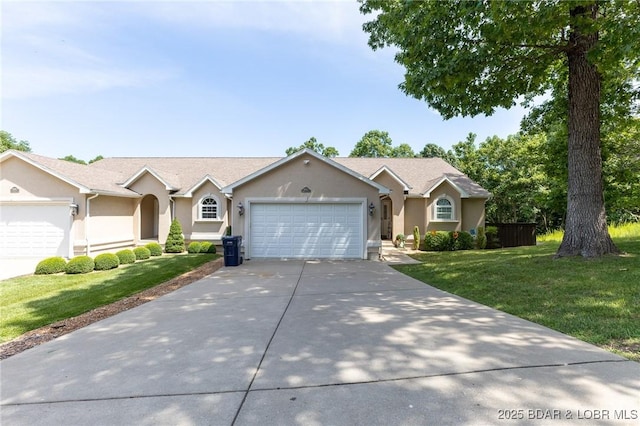 4331 Sunset Dr Unit B, Osage Beach, MO 65065 - single story home with stucco siding, an attached garage, a front yard, and driveway