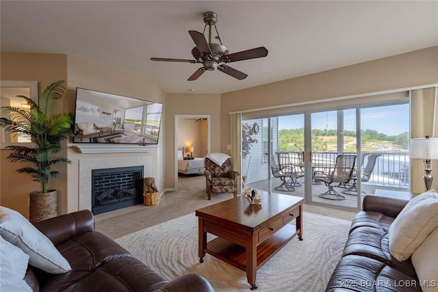 275 Flynn Rd Unit 105, Lake Ozark, MO 65049 - living area with carpet, a tiled fireplace, and ceiling fan