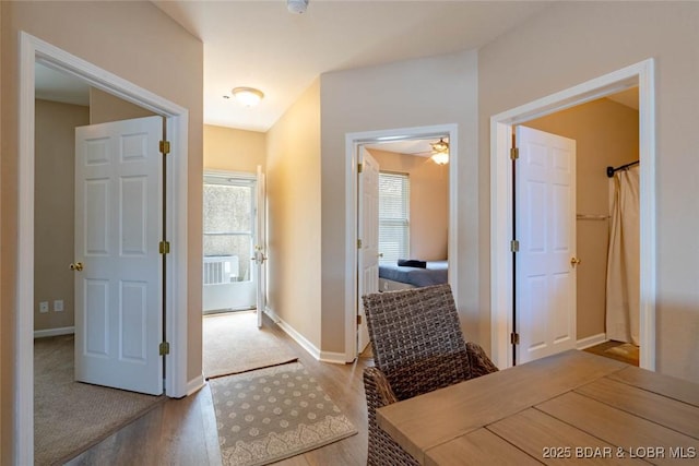 275 Flynn Rd Unit 105, Lake Ozark, MO 65049 - hall with healthy amount of natural light and wood finished floors
