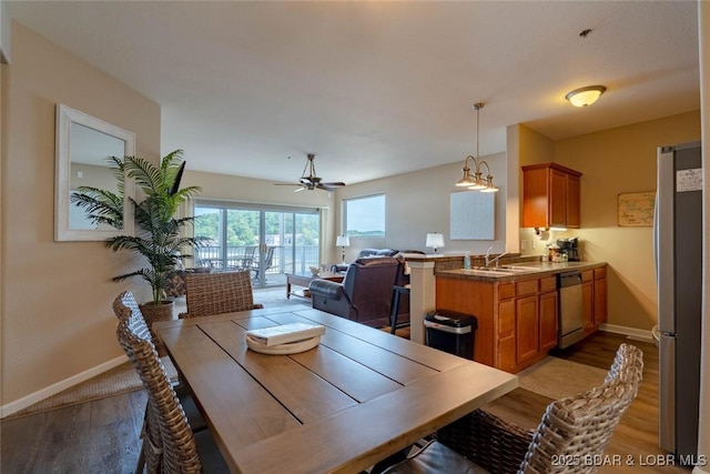 275 Flynn Rd Unit 105, Lake Ozark, MO 65049 - dining space featuring wood finished floors and a ceiling fan