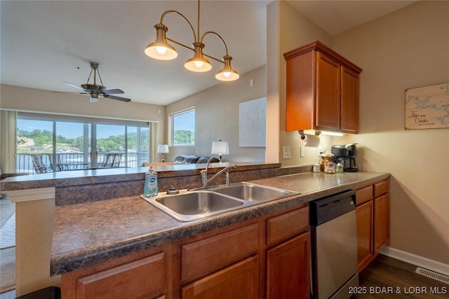 275 Flynn Rd Unit 105, Lake Ozark, MO 65049 - kitchen featuring dishwasher, dark countertops, ceiling fan, brown cabinets, and dark wood finished floors