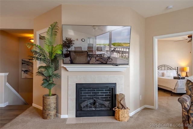 275 Flynn Rd Unit 105, Lake Ozark, MO 65049 - living room with carpet, a ceiling fan, and a fireplace