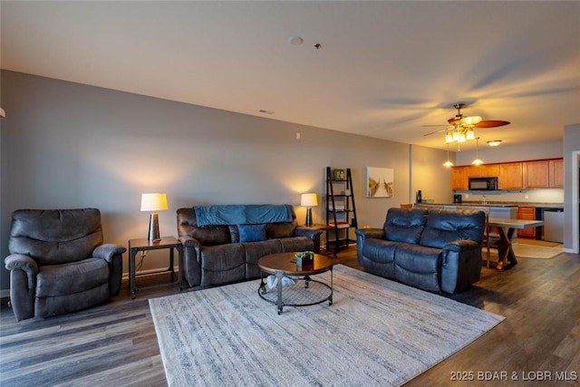 275 Flynn Rd Unit 105, Lake Ozark, MO 65049 - living room featuring dark wood-style floors and a ceiling fan