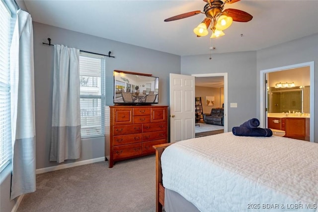 275 Flynn Rd Unit 105, Lake Ozark, MO 65049 - bedroom with light colored carpet, ensuite bathroom, and ceiling fan