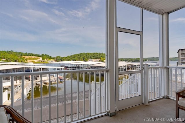 275 Flynn Rd Unit 105, Lake Ozark, MO 65049 - unfurnished sunroom with plenty of natural light and a water view
