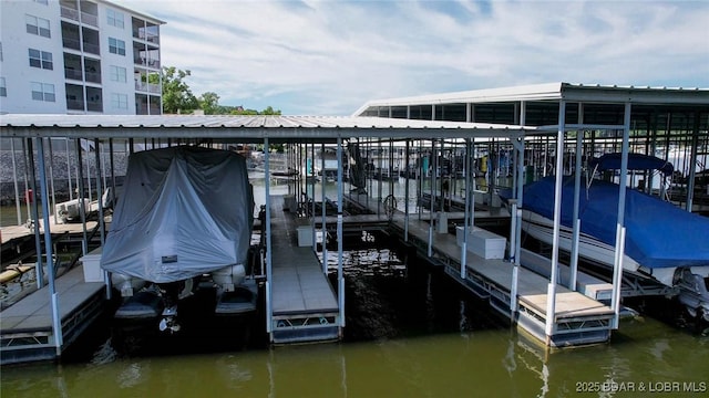 275 Flynn Rd Unit 105, Lake Ozark, MO 65049 - dock featuring boat lift and a water view