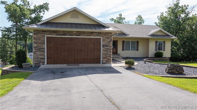 15 Knox Point Cir, Lake Ozark, MO 65049 - single story home with driveway, stone siding, a garage, a standing seam roof, and a metal roof