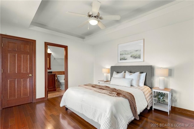 1129 Beacon Pointe Cir, Lake Ozark, MO 65049 - bedroom with a raised ceiling, dark wood-style floors, ensuite bathroom, and ceiling fan
