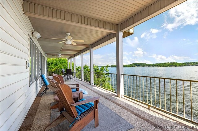 1129 Beacon Pointe Cir, Lake Ozark, MO 65049 - sunroom featuring ceiling fan and a water view
