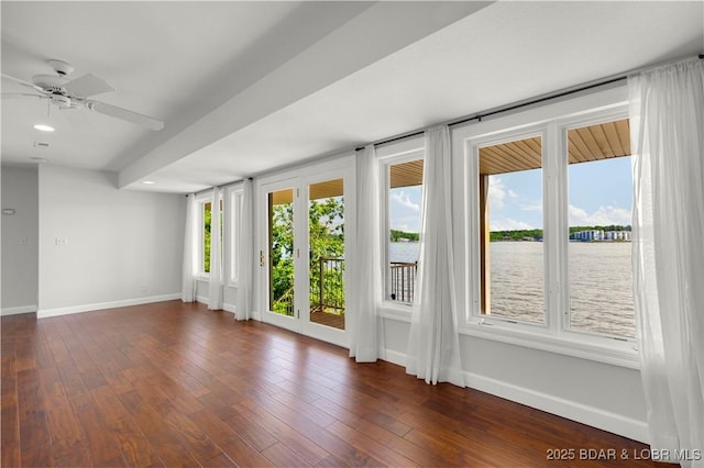 1129 Beacon Pointe Cir, Lake Ozark, MO 65049 - unfurnished room featuring healthy amount of natural light, ceiling fan, a water view, dark wood-type flooring, and recessed lighting
