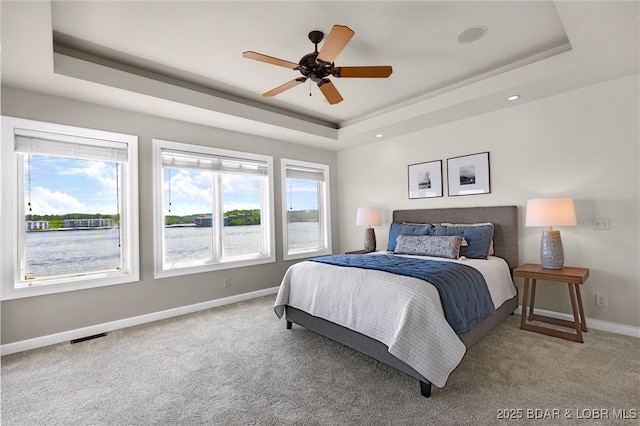 1129 Beacon Pointe Cir, Lake Ozark, MO 65049 - carpeted bedroom with a raised ceiling and a ceiling fan