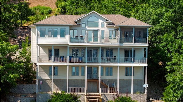 1129 Beacon Pointe Cir, Lake Ozark, MO 65049 - back of property with a balcony and stairway