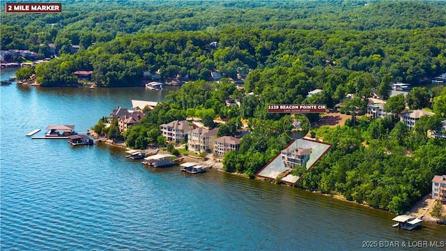 1129 Beacon Pointe Cir, Lake Ozark, MO 65049 - drone / aerial view of a forest and a large body of water
