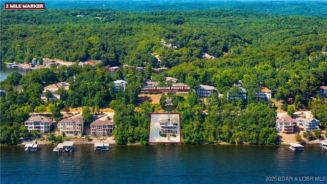 1129 Beacon Pointe Cir, Lake Ozark, MO 65049 - aerial view of a forest and a large body of water